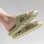 Liveify light green waterproof slip-on sandals with drainage holes, ideal for pool or beach use