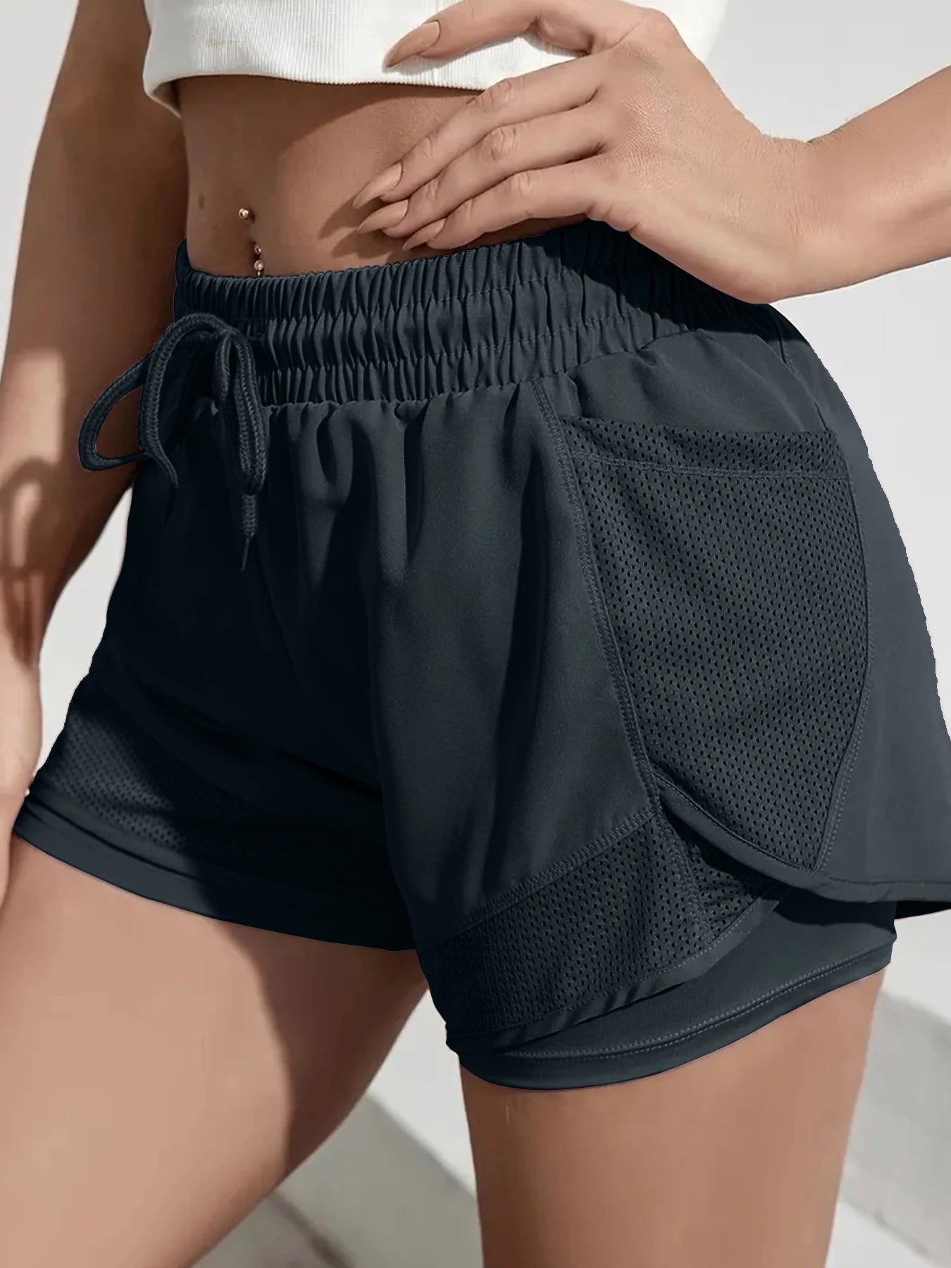 Liveify black mesh panel athletic shorts with drawstring waist, ideal for gym or running