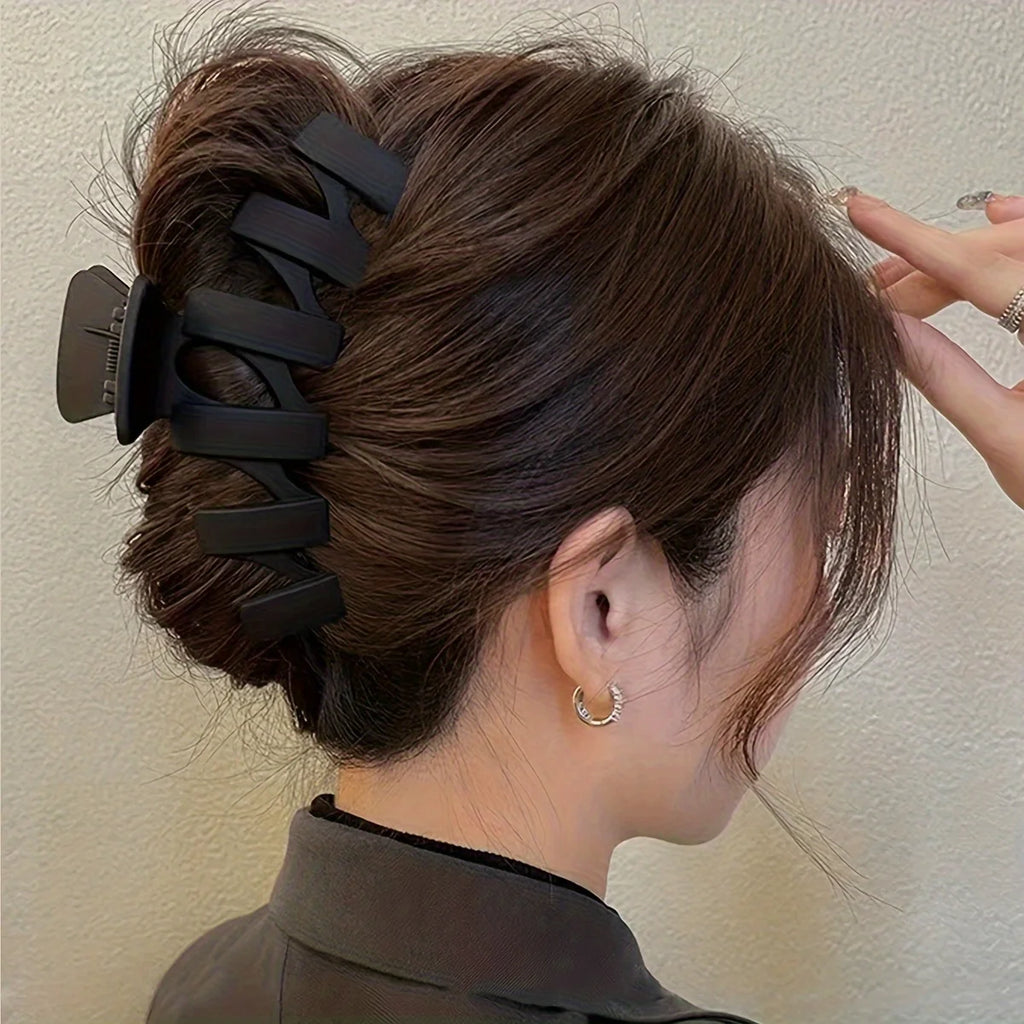 Liveify black matte hair claw clip securing a messy bun, stylish and functional for daily wear