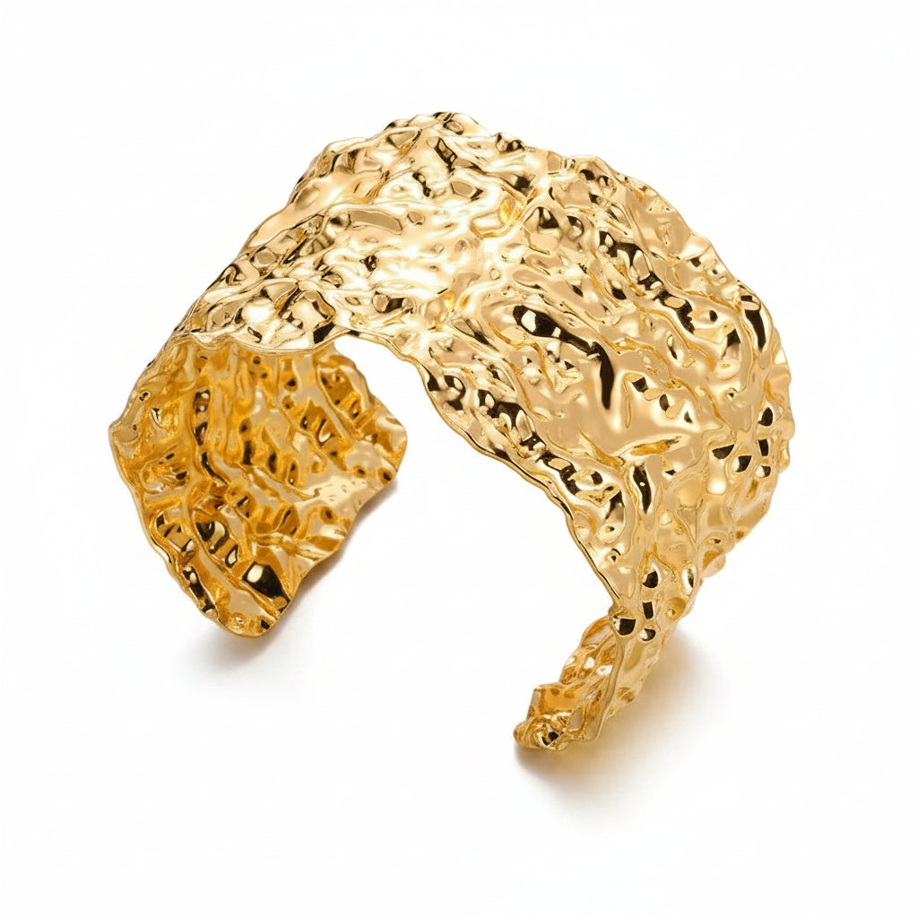 Liveify gold textured cuff bracelet with organic, wavy design on soft fabric background