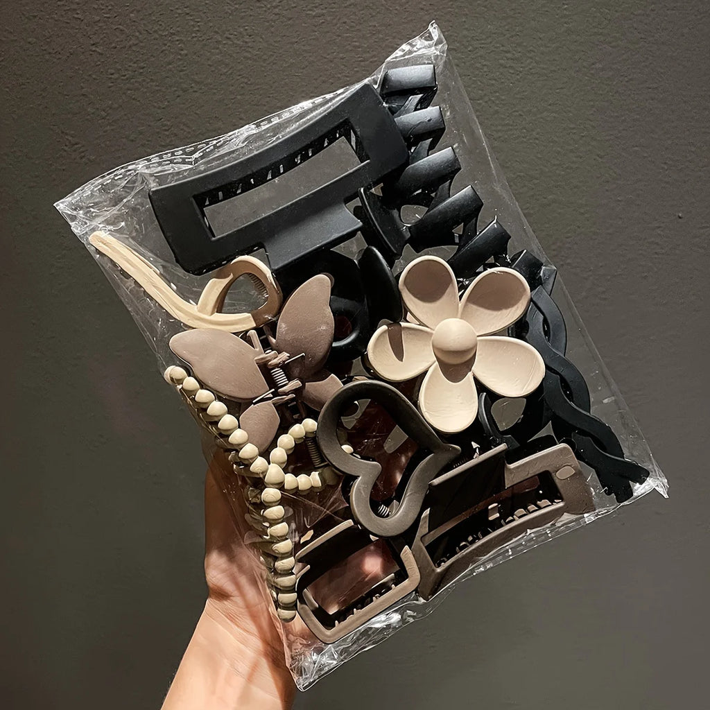 Liveify assorted hair clips in black, beige, and brown with floral, beaded, and geometric designs in clear packaging