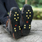 Liveify black rubber ice cleats with yellow spikes for hiking boots on rocky terrain
