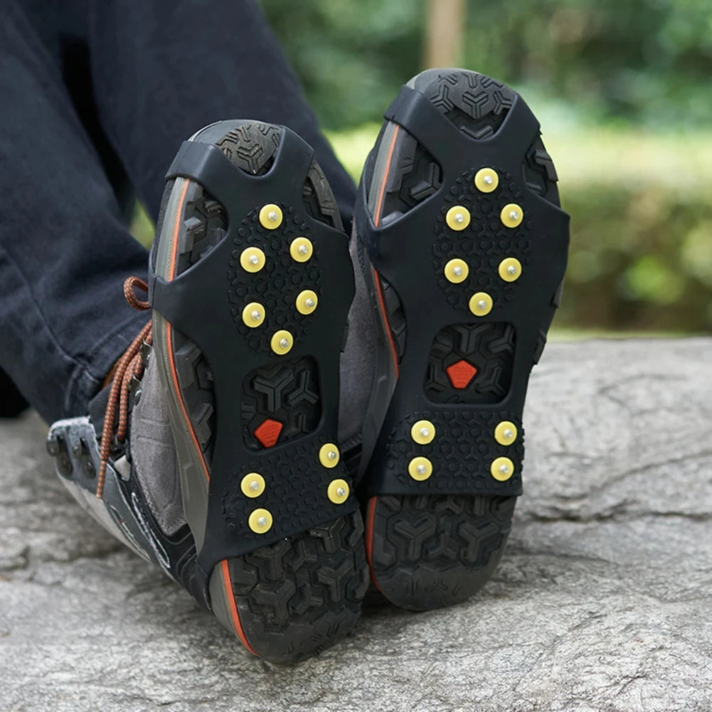 Liveify black rubber ice cleats with yellow spikes for hiking boots on rocky terrain