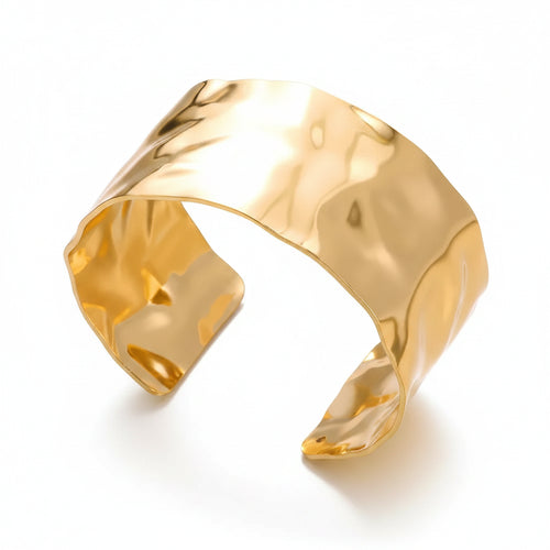 Liveify gold hammered cuff bracelet with textured finish on soft fabric background