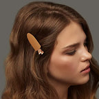 Liveify beige matte hair clip with rose gold accent, stylishly holding wavy brown hair for everyday looks