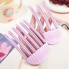 Liveify pink plastic hair curler clips for styling, held in hand with soft grip design