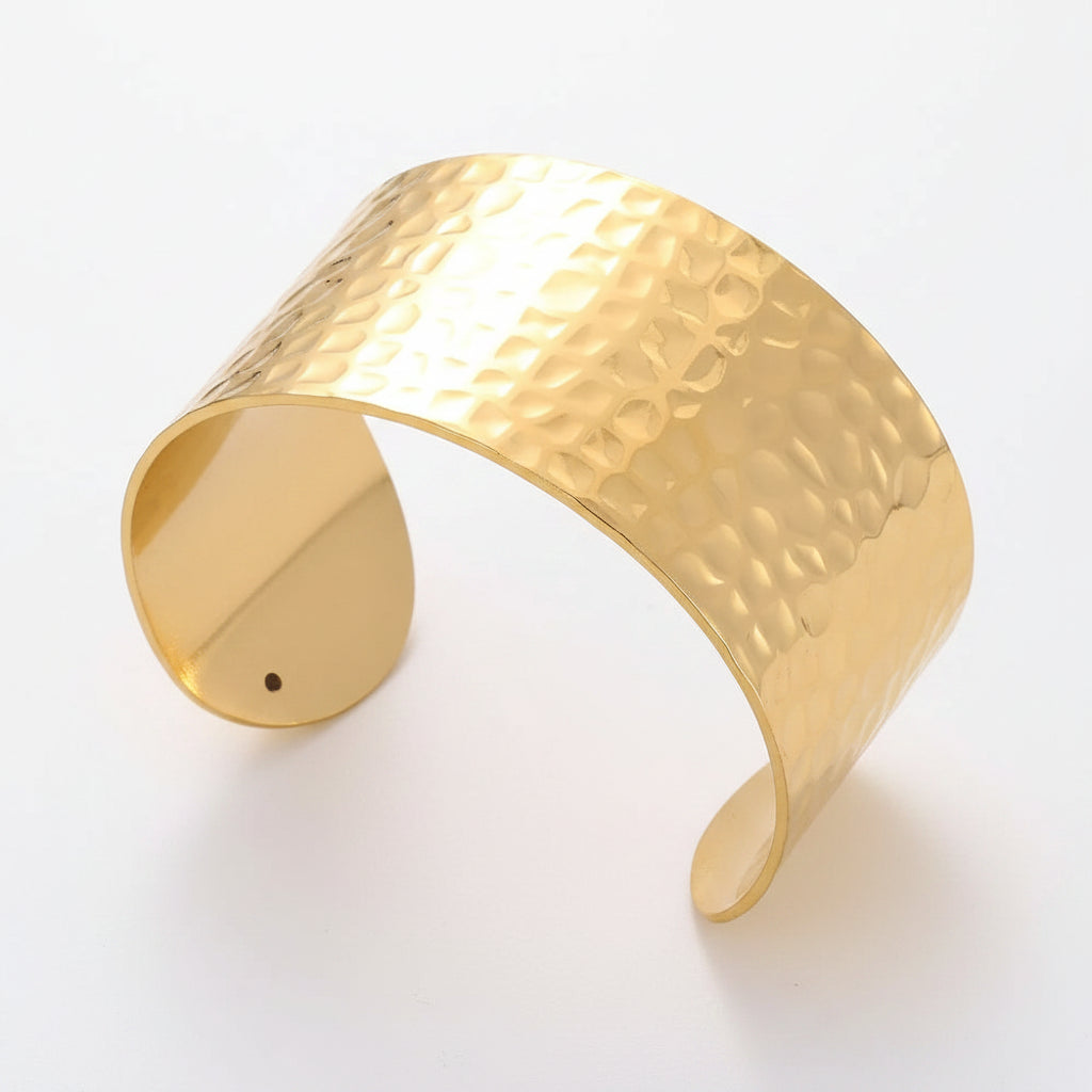Liveify gold hammered cuff bracelet with textured finish on soft fabric background