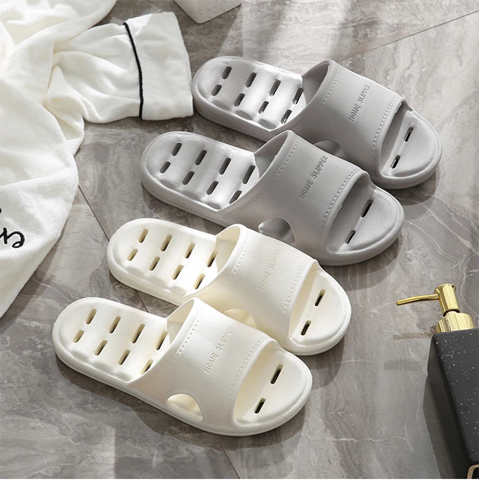 Liveify white and gray home slippers with breathable holes, soft material, and stylish design for comfort.