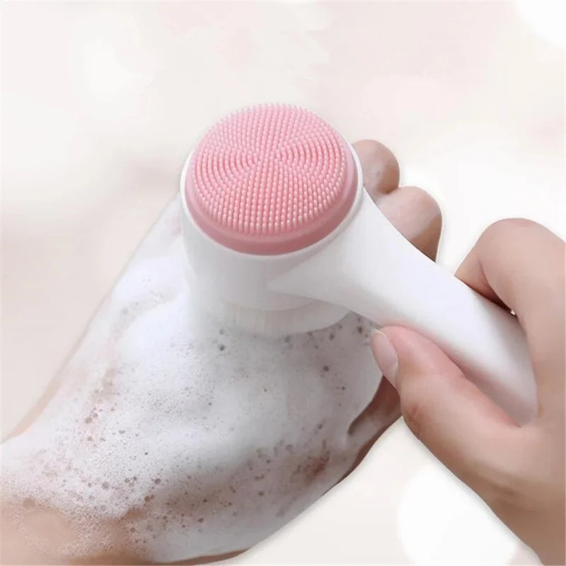 Liveify pink silicone facial cleansing brush with white handle, creating lather on hand for gentle skincare