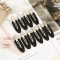 Liveify black matte hair clips with silver metal clasp, sleek modern design for everyday styling