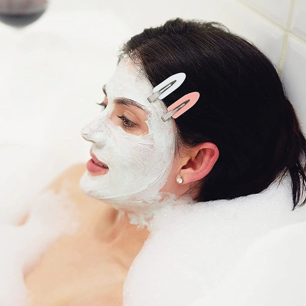 Liveify white and pink hair clips holding back dark hair during facial mask bath, beauty self-care routine