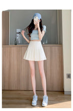 Liveify white pleated tennis skirt with light blue crop top and matching sneakers, casual summer outfit