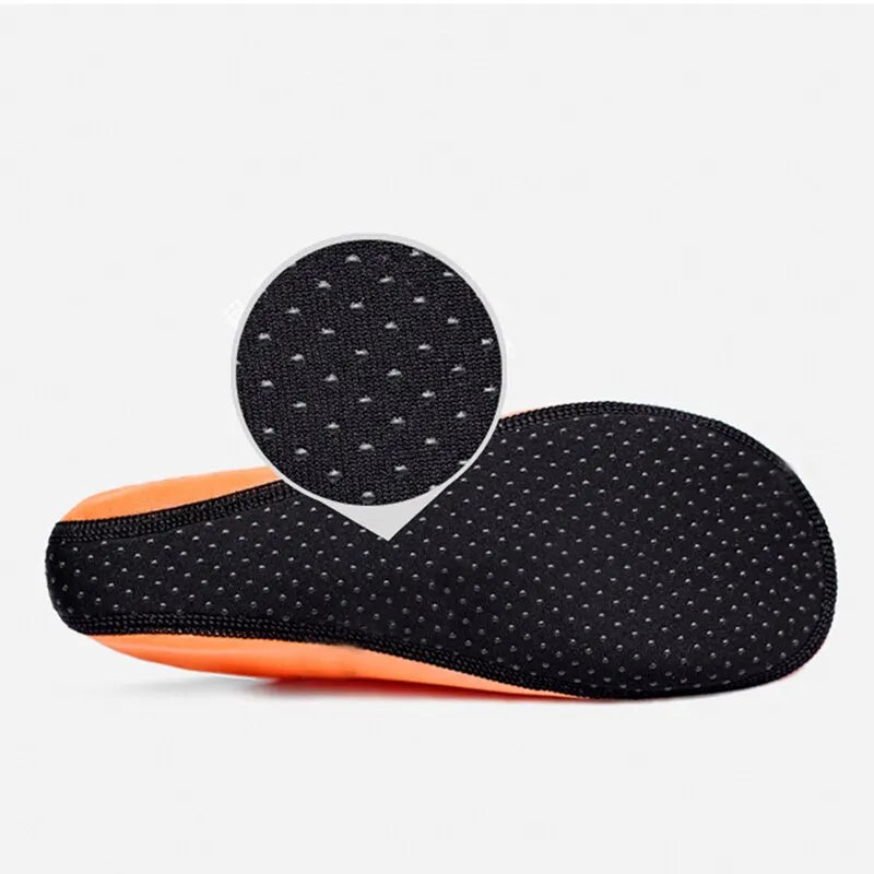 Liveify black and orange non-slip grip insoles with breathable perforated design for comfort and support