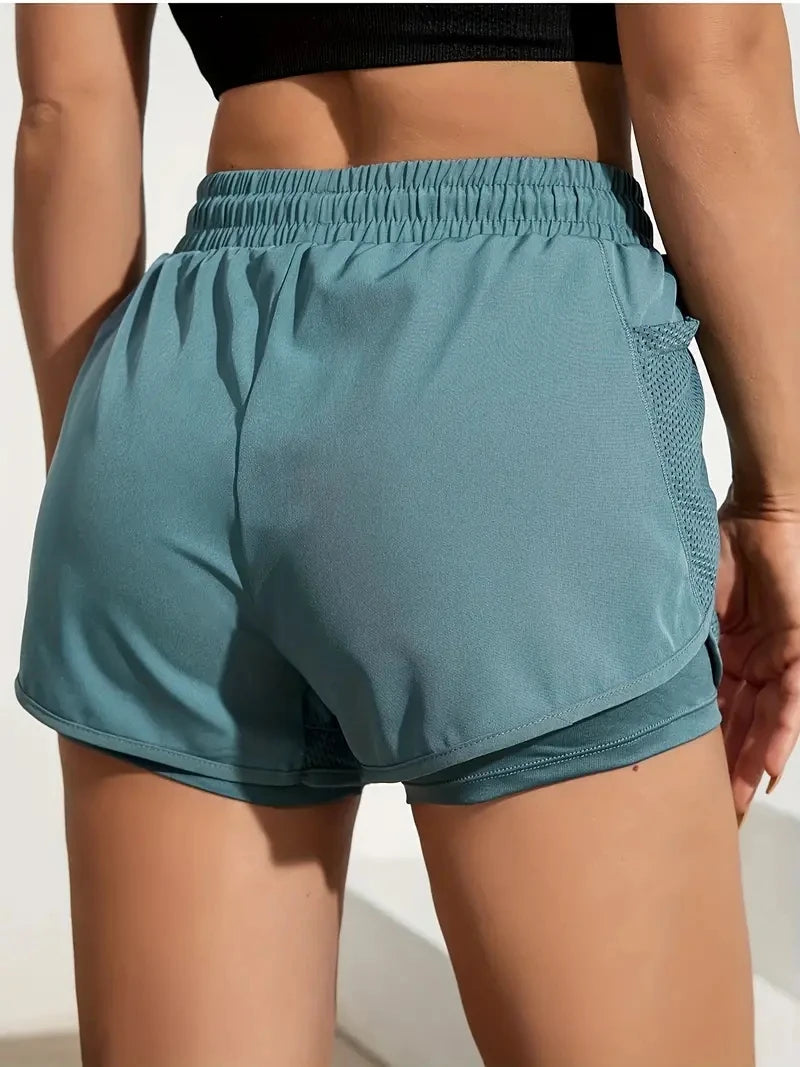 Liveify teal athletic shorts with mesh side pocket and elastic waistband