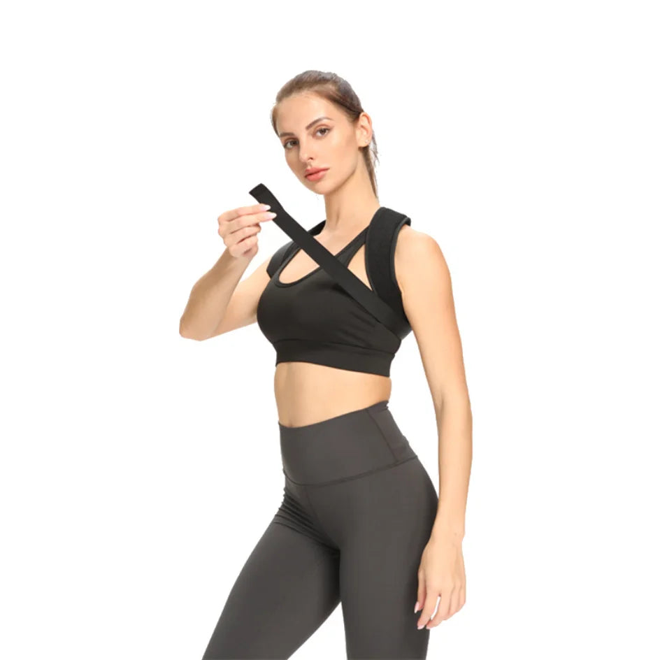 Liveify black posture corrector strap worn over sports bra, adjustable design for back support and alignment