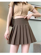 Liveify brown pleated mini skirt with high waist, paired with tan button-up crop top, stylish casual outfit