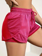 Liveify pink mesh panel athletic shorts with drawstring waist, ideal for gym or running