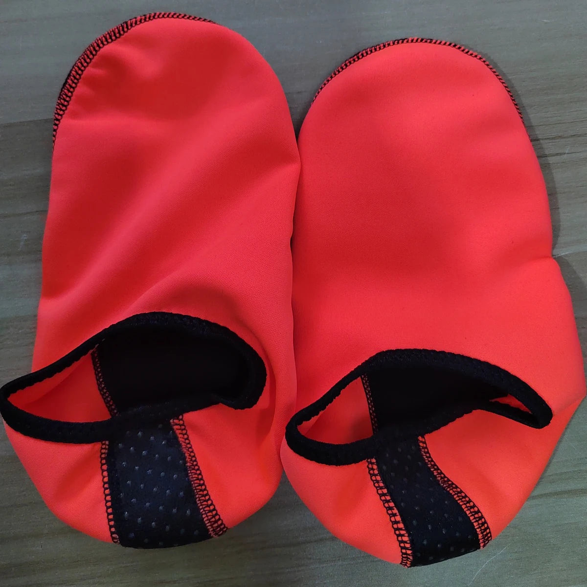 Liveify red neoprene water shoes with black grip soles and elastic trim for beach or pool use