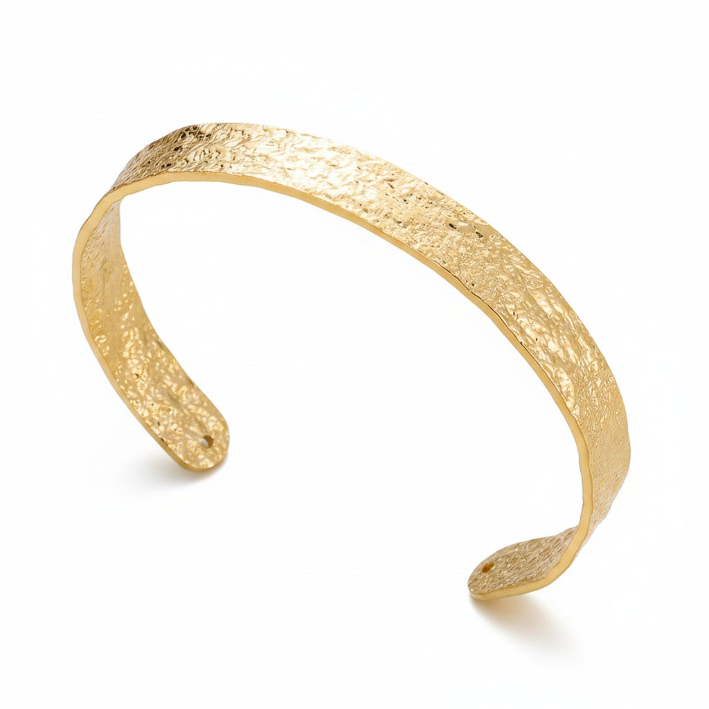 Liveify gold textured cuff bracelet with hammered finish, elegant open design on soft fabric background