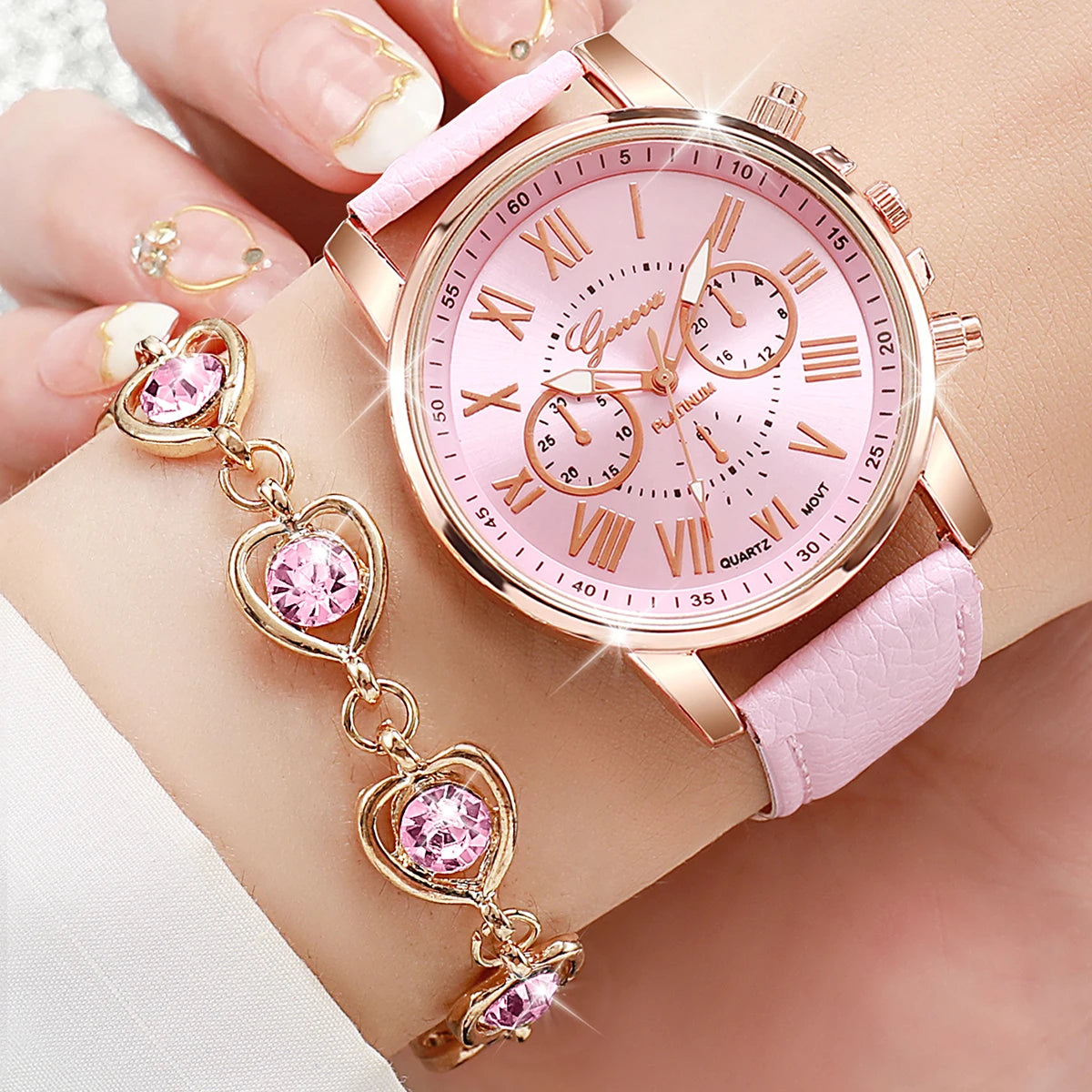 Liveify pink leather strap watch with rose gold case, Roman numerals, and matching heart charm bracelet