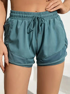 Liveify teal mesh-accented drawstring shorts for fitness and casual wear