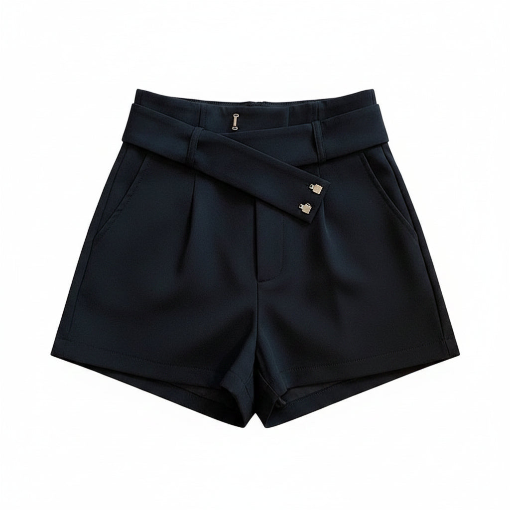 Liveify black high-waisted shorts with button details, styled on a beige couch