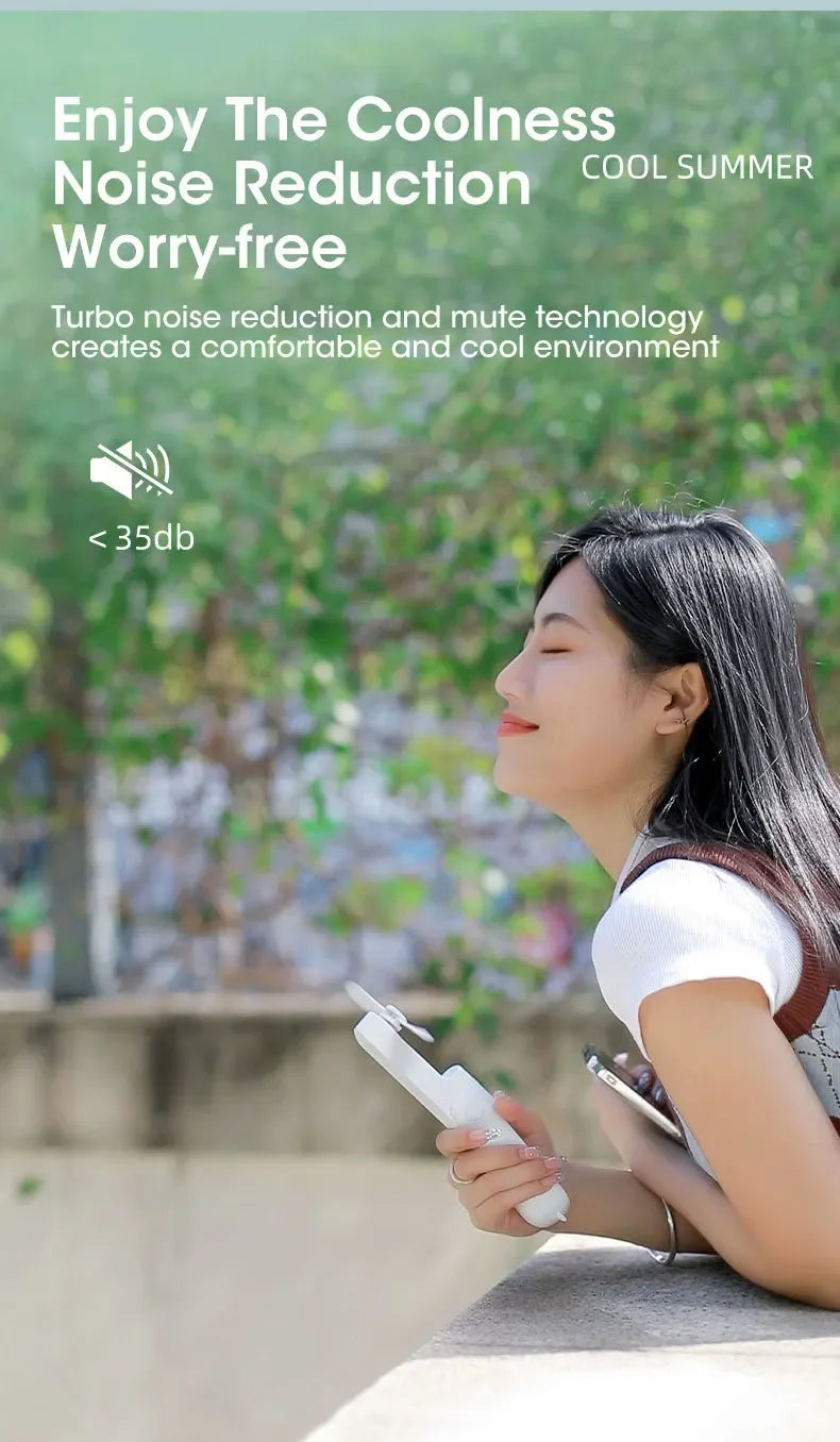 Liveify white portable mini fan with turbo noise reduction, <35db, held by woman outdoors for cool summer comfort