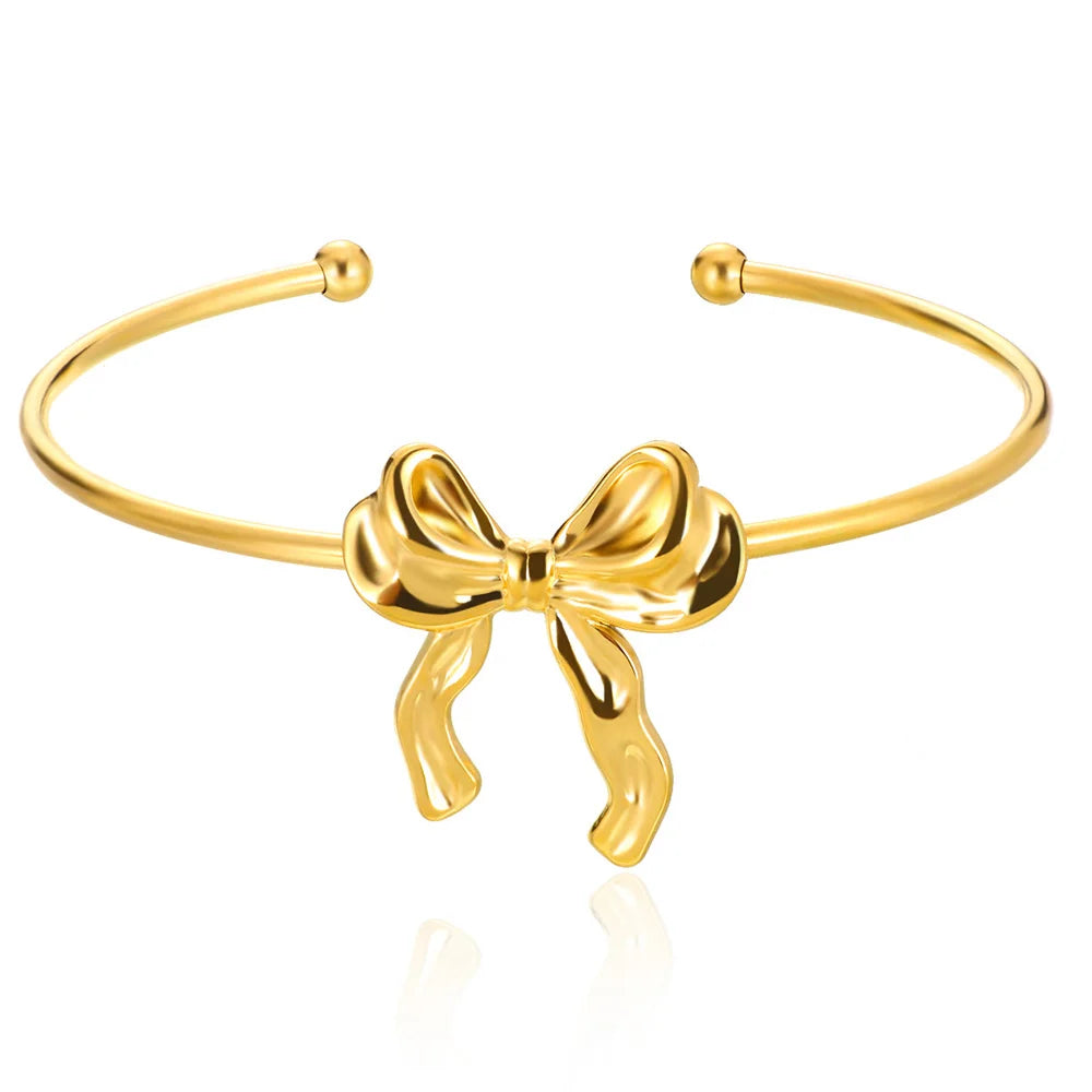 Liveify gold bow bangle bracelet with adjustable open cuff design, sleek metallic finish, elegant women's jewelry