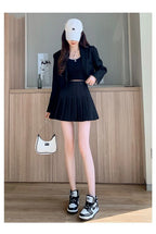 Liveify black pleated mini skirt with blazer, white cap, and sneakers outfit