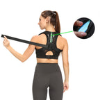 Liveify black posture corrector with adjustable straps and green accent, worn by woman in athletic wear